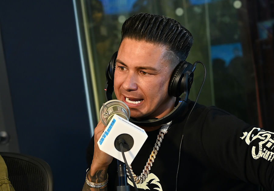 Pauly D showcasing his iconic blowout hairstyle