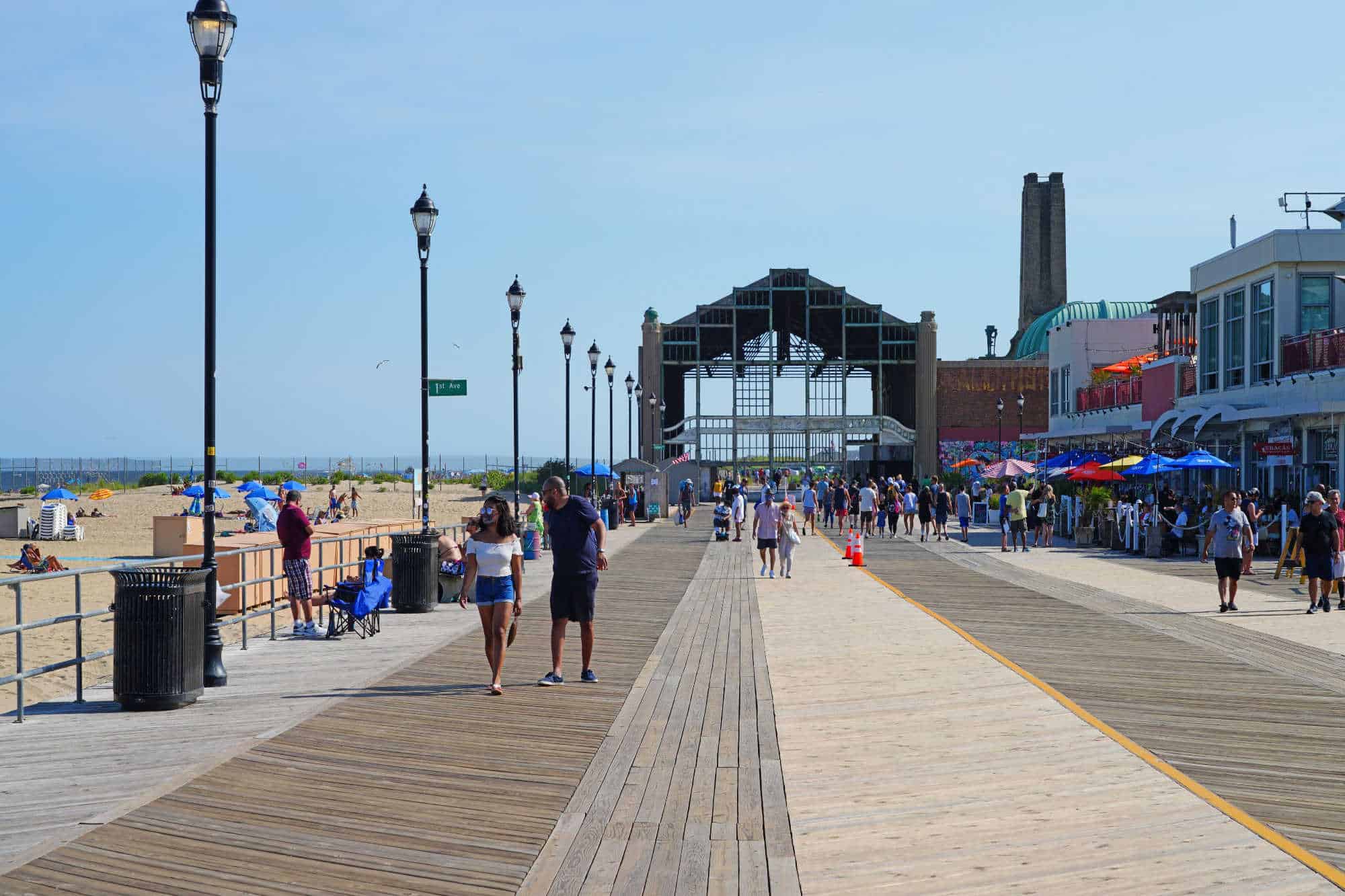 Lively and bustling atmosphere of the New Jersey boardwalk filled with tourists