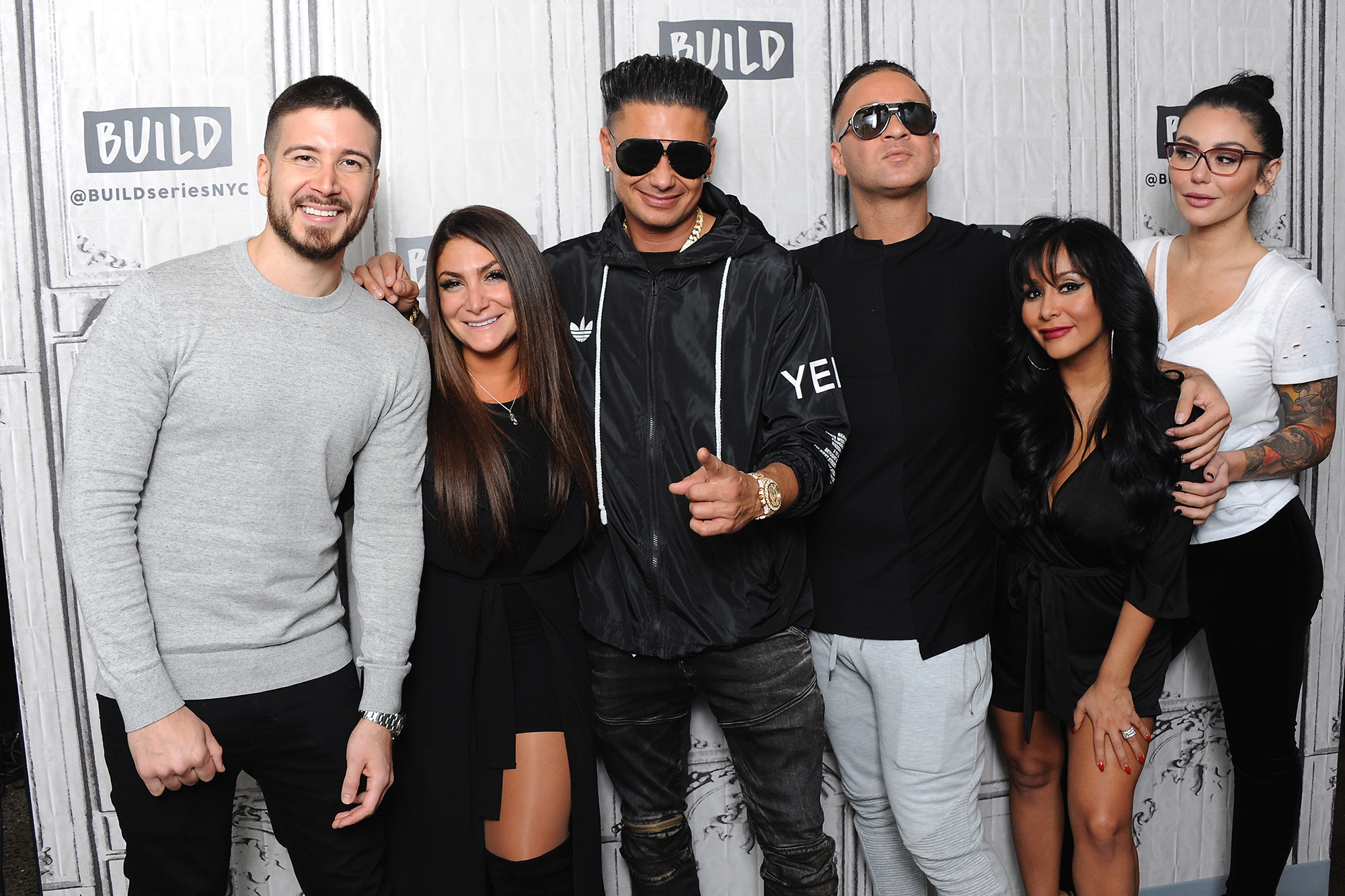 Jersey Shore cast posing together, known for their unique slang language