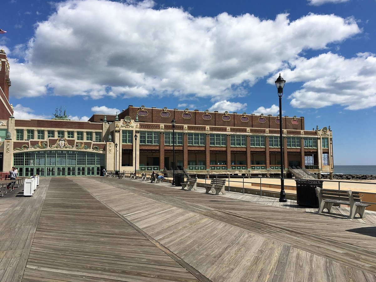 Vibrant Asbury Park Boardwalk filled with people and entertainment